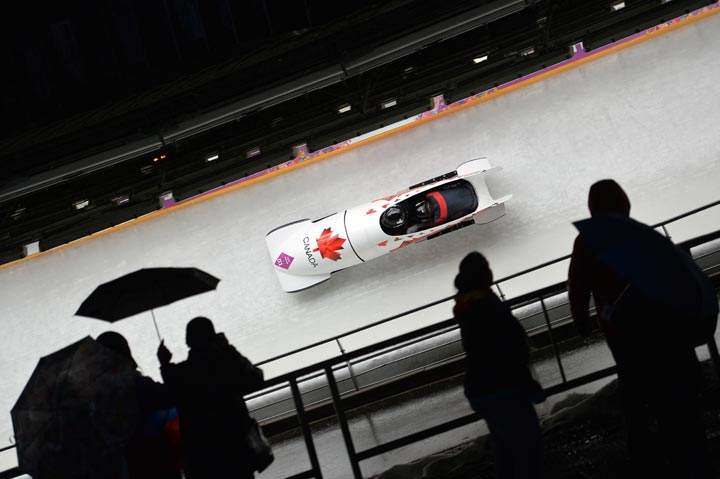 Canada-1 two-woman bobsleigh pilot Kaillie Humphries and Heather Moyse compete during the Women’s Bobsleigh Heat 2 at the Sliding Center Sanki during the Sochi Winter Olympics on February 18, 2014. (Leon Neal/AFP/Getty Images)