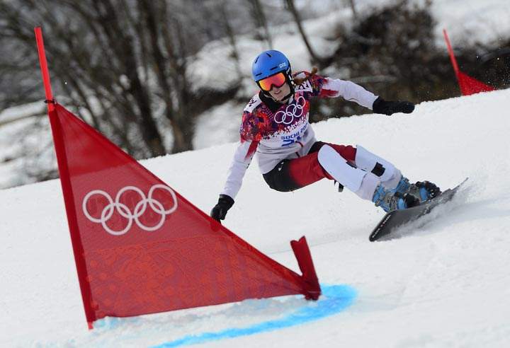 Canada’s Marianne Leeson competes in the Women’s Snowboard Parallel Giant Slalom 1/8 Finals at the Rosa Khutor Extreme Park during the Sochi Winter Olympics on February 19, 2014. (Javier Soriano/AFP/Getty Images)
