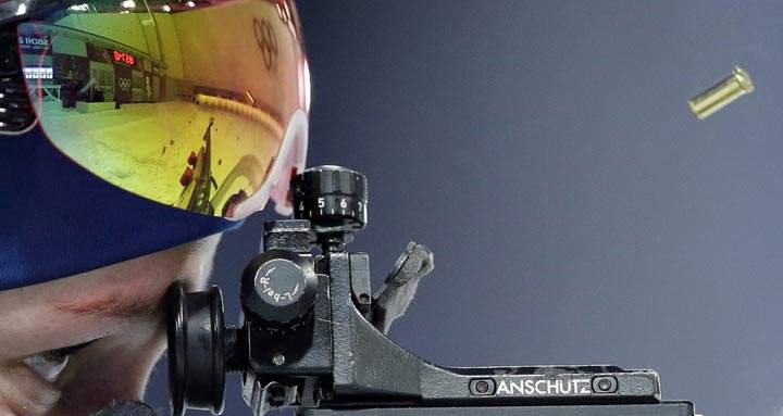 Norway’s Tiril Eckhoff shoots during the mixed biathlon relay at the 2014 Winter Olympics, Wednesday, Feb. 19, 2014, in Krasnaya Polyana, Russia. (AP Photo/Lee Jin-man)