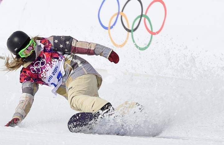 U.S. Jamie Anderson ends her last run to win Gold in the Women’s Snowboard Slopestyle Final at the Rosa Khutor Extreme Park during the Sochi Winter Olympics on February 9, 2014. (Javier Soriano/AFP/Getty Images)