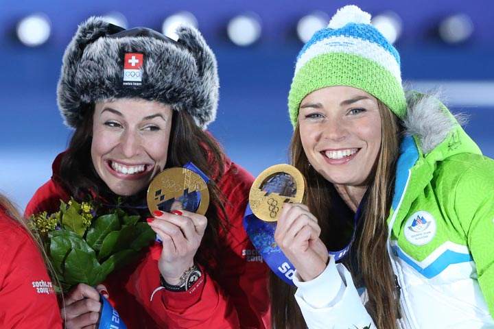 Gold medallists Switzerland’s Dominique Gisin (L) and Slovenia’s Tina Maze pose on the podium during the Women’s Alpine Skiing Downhill Medal Ceremony at the Sochi medals plaza on February 12, 2014. (Loic Venance/AFP/Getty Images)