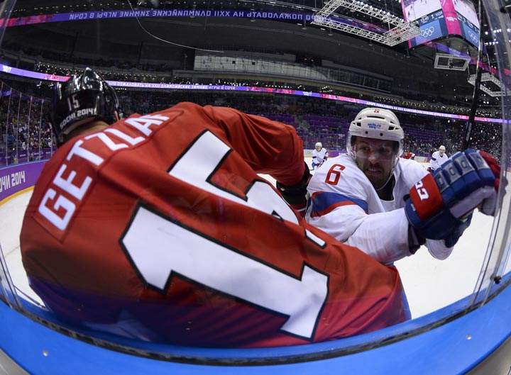 Canada’s Ryan Getzlaf vies with Norway’s Jonas Holoes during the Men’s Ice Hockey Group B match between Canada and Norway at the Sochi Winter Olympics on February 13, 2014 at the Bolshoy Ice Dome. (Jonathan Nackstrand/AFP/Getty Images)