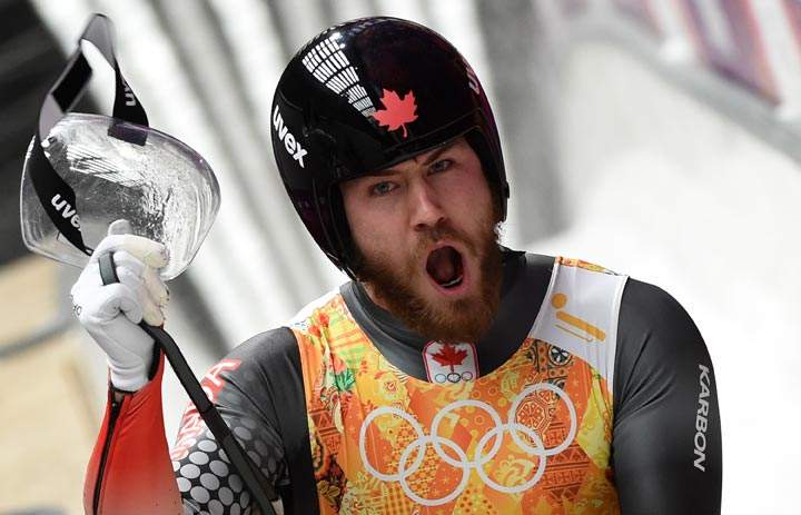 Canada’s doubles Tristan Walker and Justin Snith compete in the Luge Team Relay at the Sliding Center Sanki during the Sochi Winter Olympics on February 13, 2014. (Leon Neal/AFP/Getty Images)