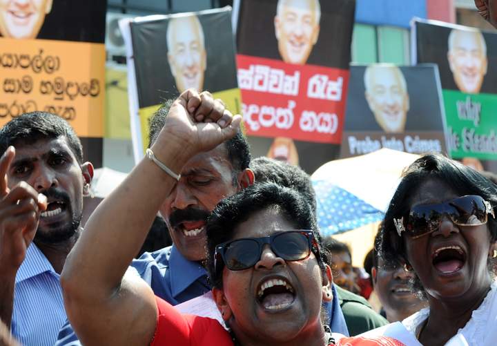 Sri Lankan Pro-government activists protest outside the US embassy in the capital Colombo on January 9, 2014. Buddhist monks led demonstrations in the capital Colombo on January 9 denouncing the visit by a US envoy who is charged with assessing allegations of war crimes against Sri Lanka.