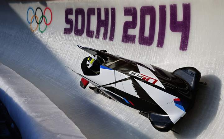 Cory Butner of United States pilots a bobsleigh practice run.