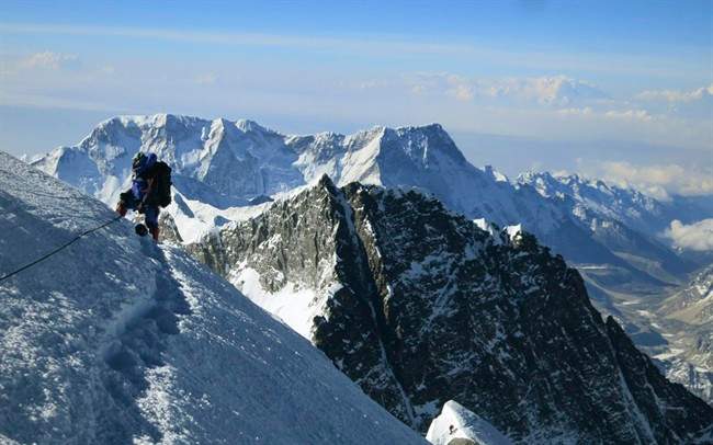 In this May 18, 2013 photo released by Alpenglow Expeditions, a climber pauses on the way to the summit of Mount Everest, in the Khumbu region of the Nepal Himalayas.