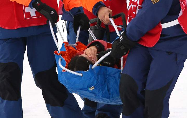 Yuki Tsubota is carried off the hill