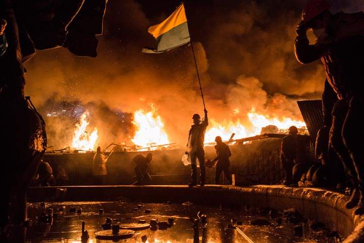 Anti-government protesters guard the perimeter of Independence Square, known as Maidan, on February 19, 2014 in Kyiv, Ukraine. (Photo credit: Brendan Hoffman/Getty Images)