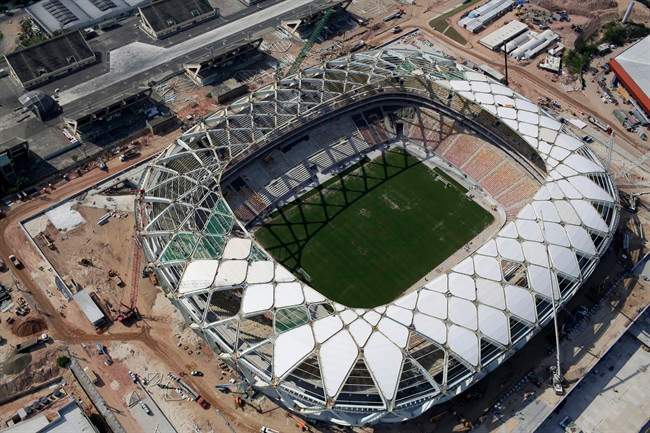 This Dec. 10, 2013 file photo shows an aerial view of the Arena da Amazonia stadium in Manaus, Brazil. A worker was injured in an accident outside this World Cup stadium, local organizers said Friday, Feb. 7, 2014. Organizers in charge of the stadium's construction said the worker was hurt while dismantling a crane that was used to install the roof. 