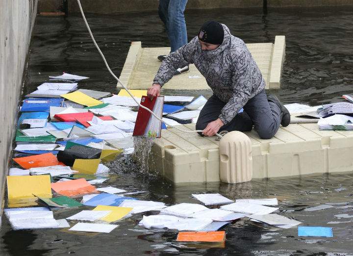Volunteers pulled thousands of documents from the water behind Viktor Yanukovych's private residence after he left Kyiv.