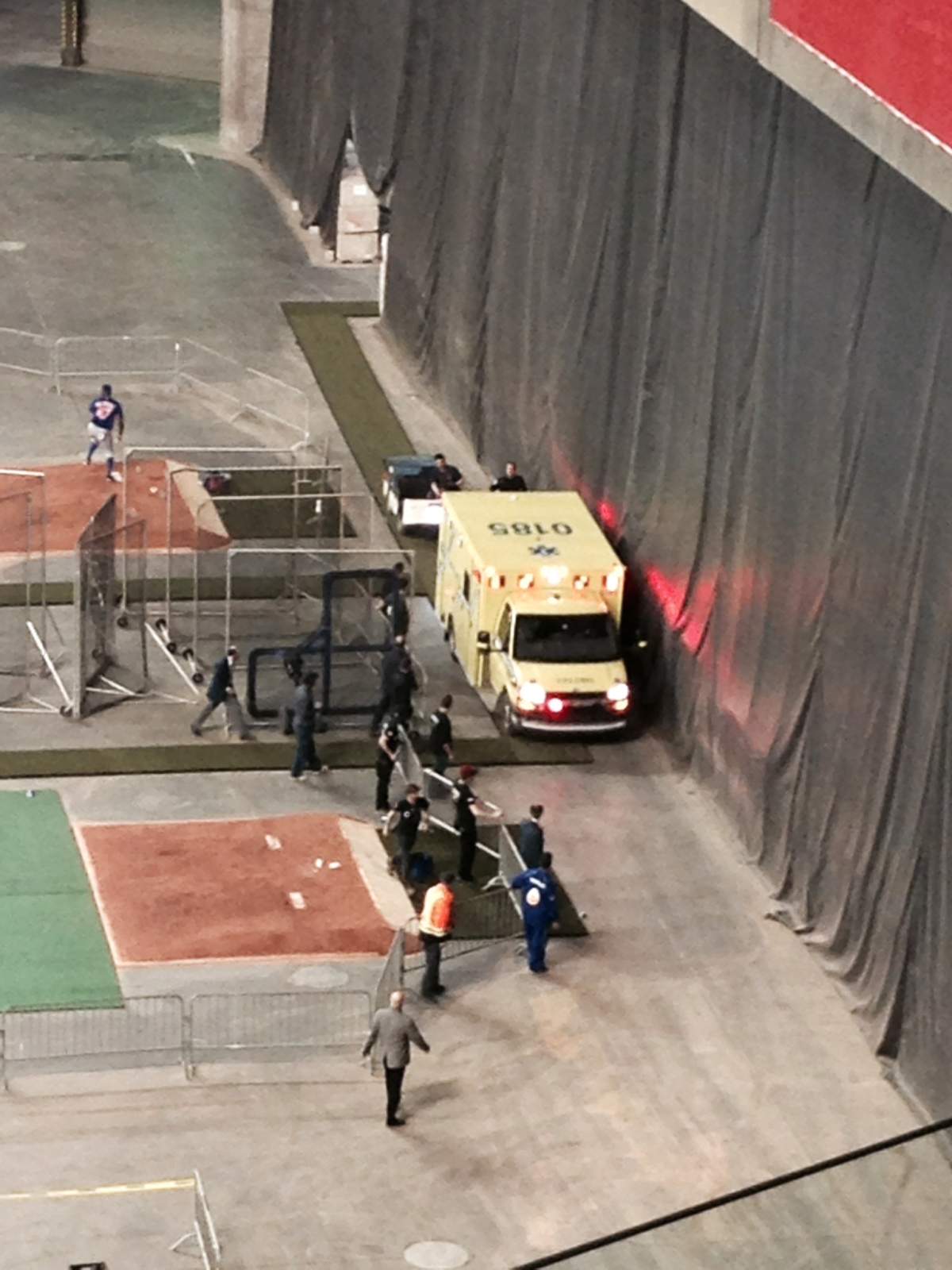 An ambulance makes it way to help a fan who fell from the stands at Olympic Stadium during an exhibition game between the Toronto Blue Jays and the New York Mets in Montreal .