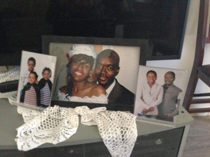 41-year-old Thierno Bah (centre with his wife) was killed at his workplace Friday, Feb. 28, 2014.