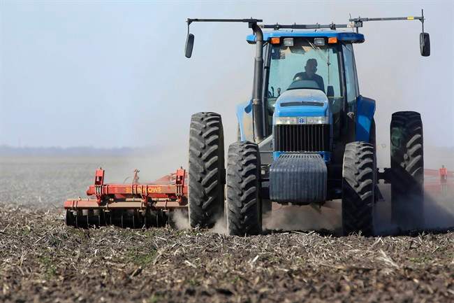A file photo of a farmer during spring seeding.