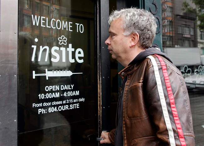 FILE PHOTO: Marc Townsend, manager of the Portland Hotel Society, enters Insite in Vancouver on October 2, 2007.