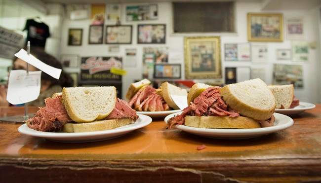 Smoked meat sandwiches sit on the counter at Schwartz's deli in Montreal, Thursday, March 8, 2012.