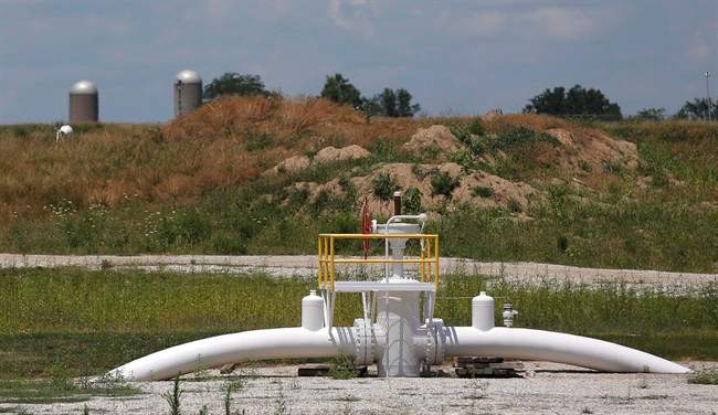 A valve extends above ground at the Enbridge Key Terminal near Salisbury, Mo., July 16, 2013. 