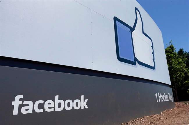 This July 16, 2013 photo shows a sign at Facebook's headquarters in Menlo Park, Calif.