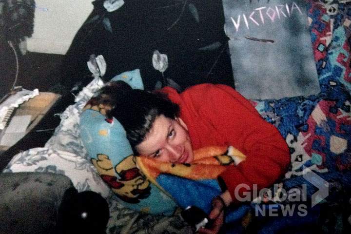 Victoria Henneberry on the couch she slept on when she lived with Jason Crawford.