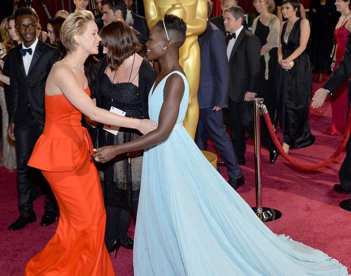 Actresses Jennifer Lawrence and Lupita Nyong’o attend the Oscars held at Hollywood & Highland Center on March 2, 2014 in Hollywood, California.