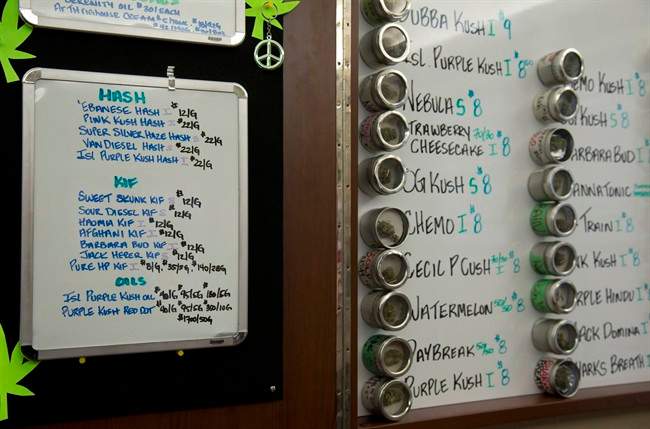 Varieties of marijuana are listed on a board that are available at The Dispensary in Vancouver, B.C. Thursday, March 6, 2014.