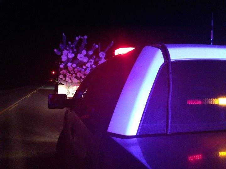 RCMP stop a logging truck on a highway near Lac La Biche Thursday, March 27, 2014.