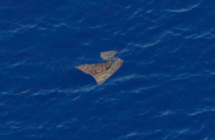 FILE - In this Saturday, March 29, 2014 file photo, an object floats in the southern Indian Ocean in this picture taken from a Royal New Zealand Air Force P-3K2 Orion aircraft searching for missing Malaysia Airlines Flight 370.
