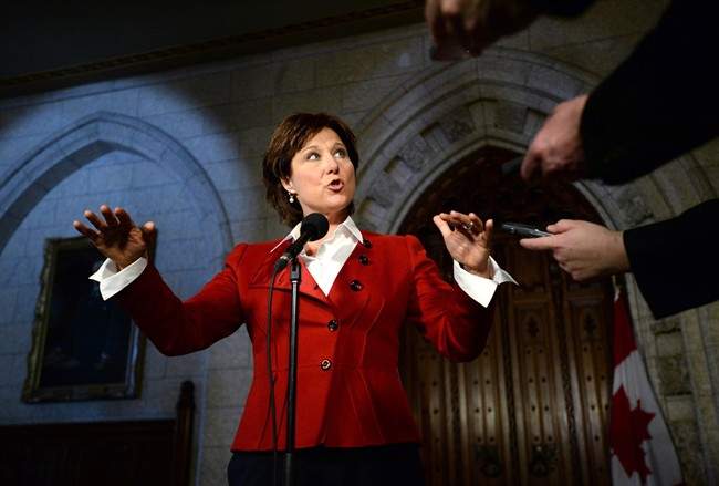 B.C. Premier Christy Clark speaks to reporters in the Foyer of the House of Commons on Parliament Hill in Ottawa on Monday, March 31, 2014. THE CANADIAN PRESS/Sean Kilpatrick.