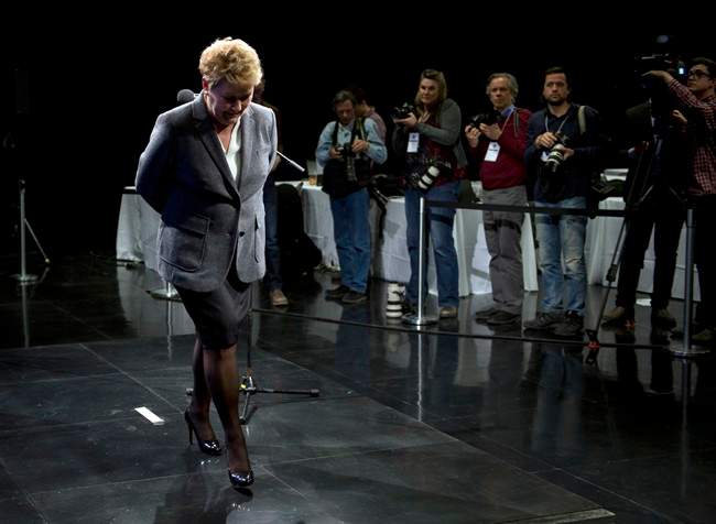 Parti Quebecois leader Pauline Marois, leaves the stage after her post-debate news conference Thursday, March 20, 2014.