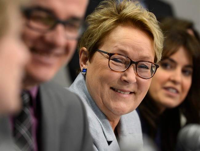 PQ leader Pauline Marois appears at a news conference during a campaign stop at a medical clinic in Laval, Que., Monday, March 17, 2014.