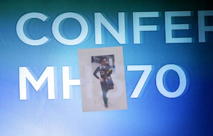 A picture of the second man, his identity still not released, who boarded the now missing Malaysia Airlines jet MH370 with a stolen passport, is displayed for the media by the Malaysian police during a press conference, Tuesday, March 11, 2014 in Sepang, Malaysia. (AP Photo/Wong Maye-E)