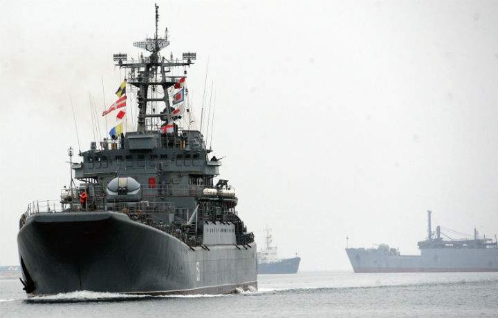 Ukrainian officials say Russian "troops" have taken over an air base in the Crimean port city of Sevastopol.