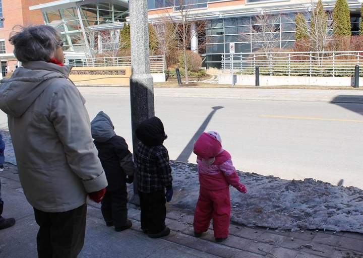 A bird? A plane? Curious onlookers look up as superheroes wash windows at Lakeridge Health on Friday March 21, 2014.