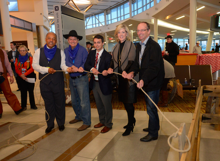 EIA CEO Tom Ruth gets ready for the first direct flight to Dallas with other officials, including American Airlines’ Will Livsey, April 2, 2014