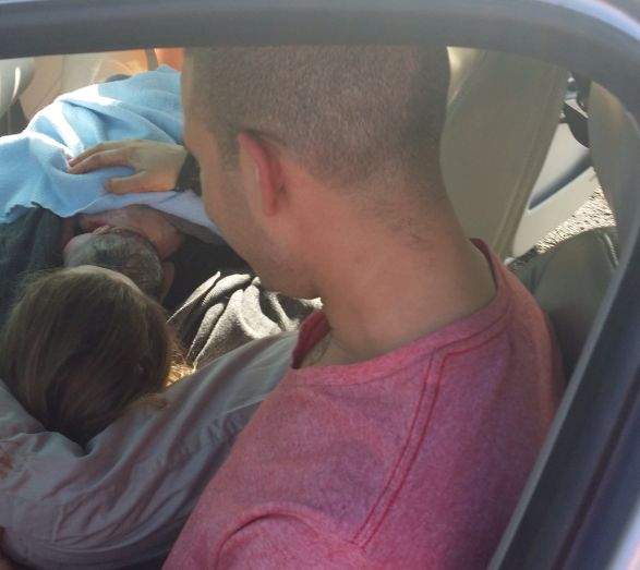 Robyn and Brook Tyler in their car after the birth of their new daughter Rosalie, April 8, 2014