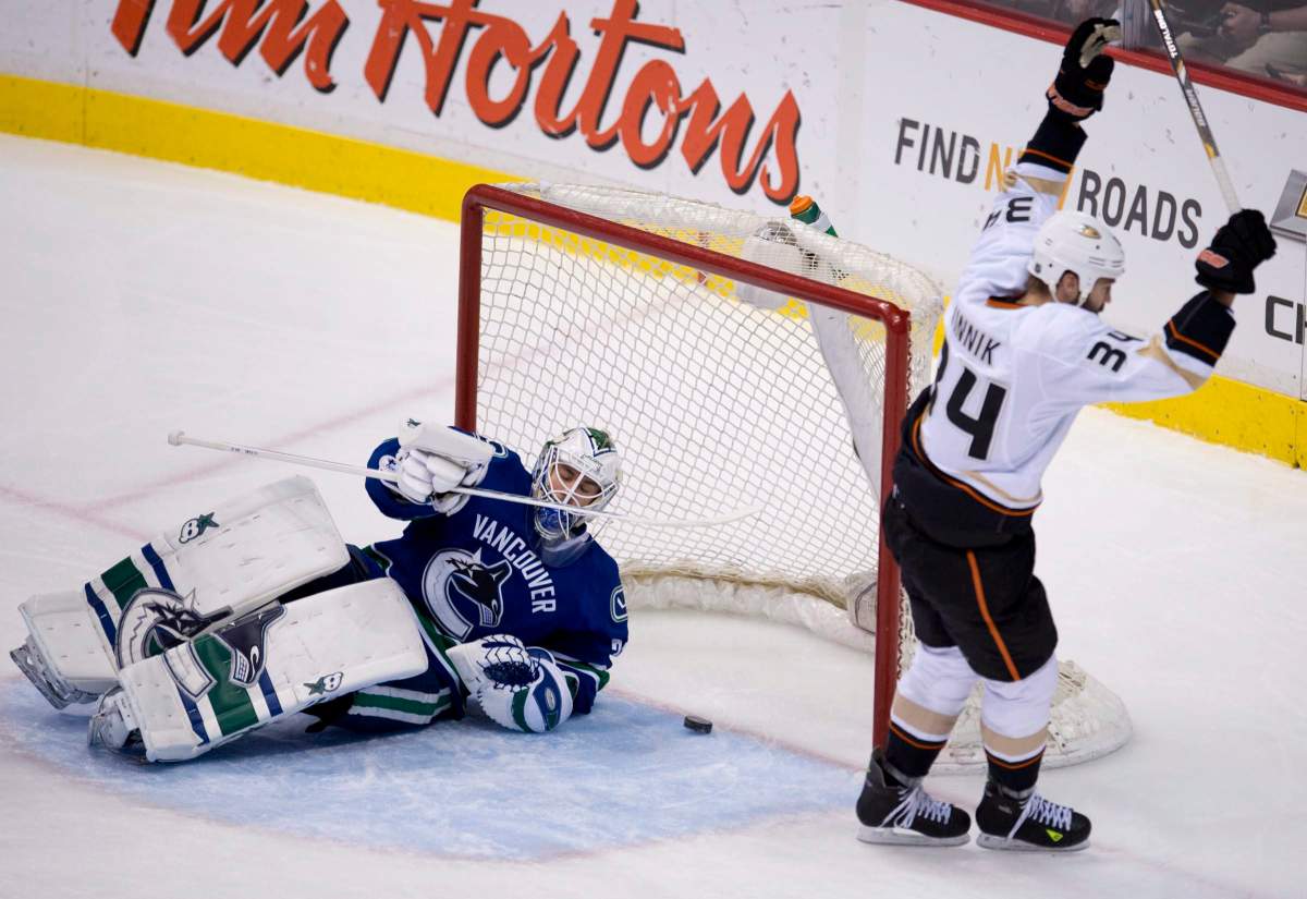 Anaheim Ducks right wing Daniel Winnik celebrates his goal past Canucks goalie Eddie Lack during the first period of NHL action in Vancouver. THE CANADIAN PRESS/Jonathan Hayward.