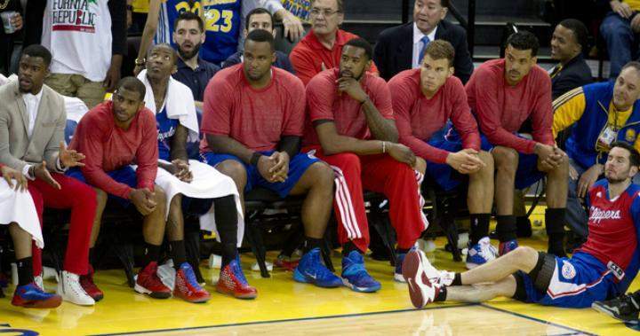 The starters for the Los Angeles Clippers watch the closing minutes of the fourth quarter of Game 4 of their Western Conference NBA playoff against the Golden State Warriors, Sunday, April 27, 2014.