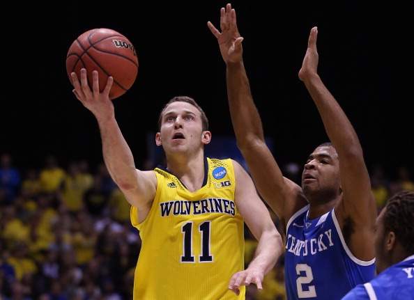 Nik Stauskas #11 of the Michigan Wolverines shoots the ball against Aaron Harrison #2 of the Kentucky Wildcats during the midwest regional final of the 2014 NCAA Men's Basketball Tournament at Lucas Oil Stadium on March 30, 2014 in Indianapolis, Indiana.  (Photo by Jonathan Daniel/Getty Images).