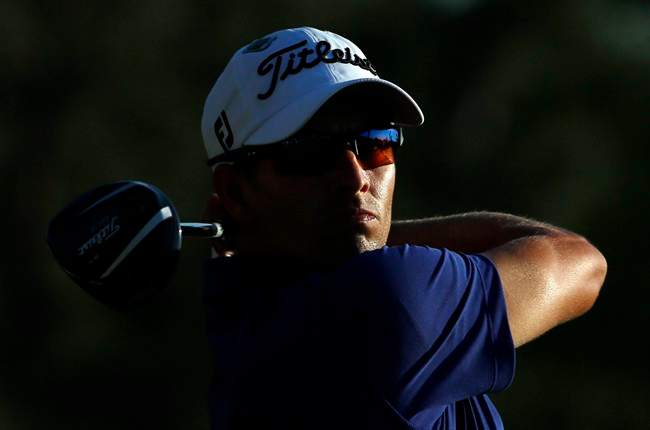 Adam Scott, of Australia, tees off during the third round of the Masters golf tournament Saturday, April 12, 2014, in Augusta, Ga.