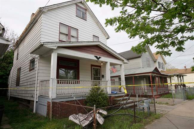 This May 7, 2013, file photo, shows a house where three women, Amanda Berry, Gina DeJesus and Michelle Knight, who went missing separately about a decade ago, escaped from captivity in Cleveland.
