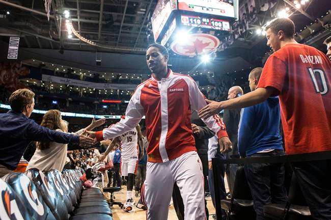 Toronto Raptors' DeMar DeRozan is congratulated by fans as he leaves the court following his team's 110-100 win over Milwaukee Bucks in NBA basketball action in Toronto on Monday, April 14, 2014.
