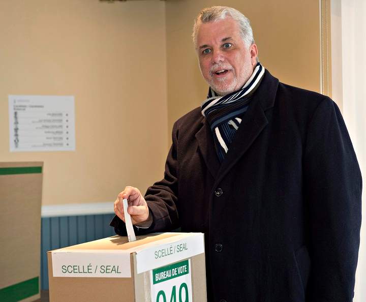 Quebec Liberal Party Leader Philippe Couillard casts his ballot Monday, April 7, 2014 in St-Felicien, Que.