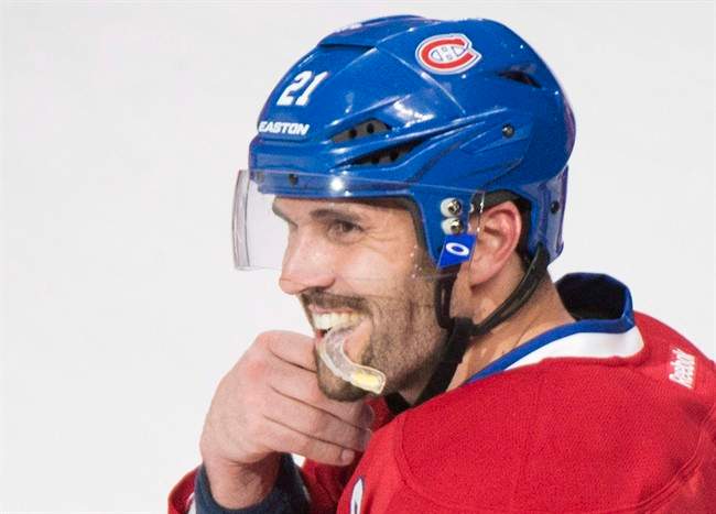Montreal Canadiens\’ Brian Gionta celebrates after scoring against the New York Rangers during overtime NHL hockey action in Montreal, April 12, 2014.