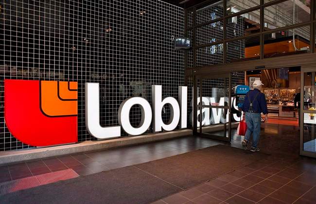 A shopper walks into a Loblaws flagship location in the old Maple Leafs Garden in Toronto in May. 