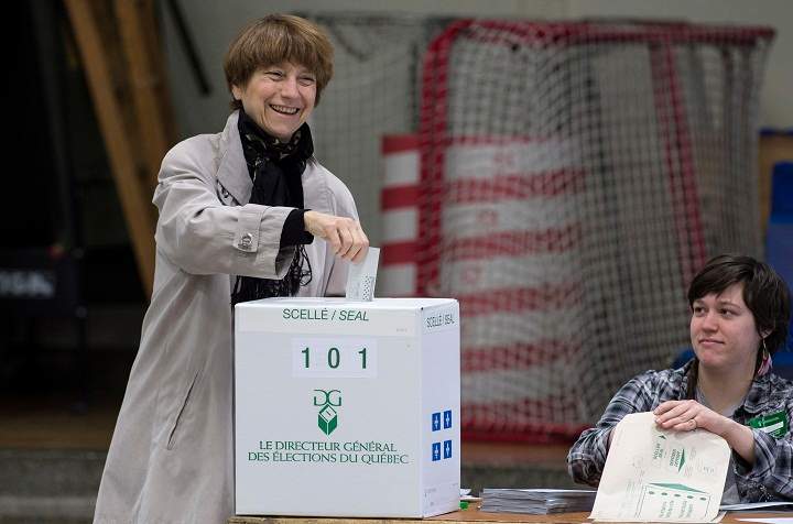Quebec Solidaire spokesperson Francoise David drops her ballot in the ballot box Monday, April 7, 2014 in Montreal.