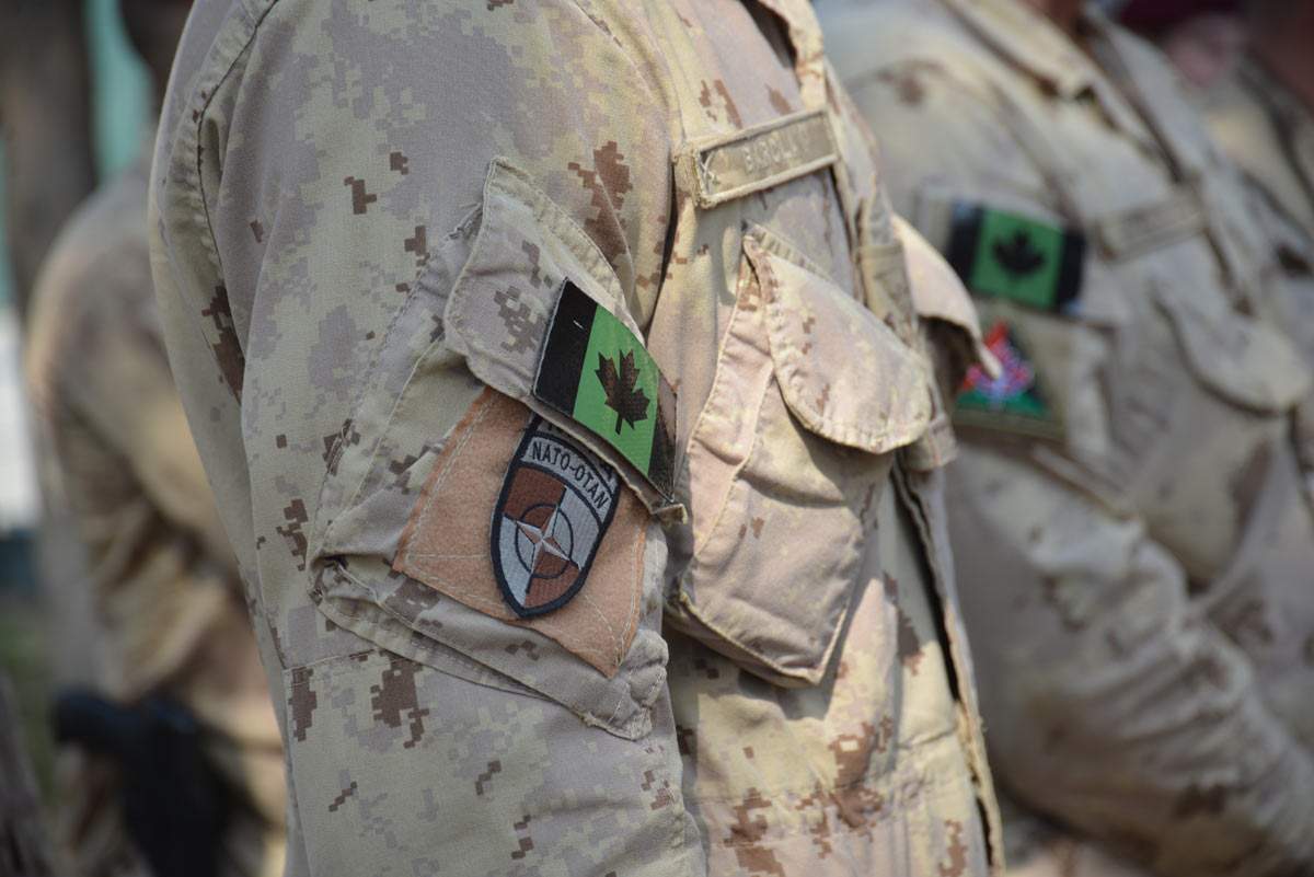 Canadian troops in Afghanistan took down the Maple Leaf flag in Kabul on March 12, 2014.