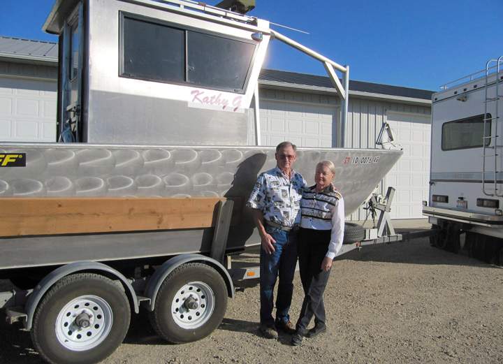 Gene Ralston and his wife, Sandy, are shown with their boat at their home in Kuna, Idaho on Monday, Sept. 10, 2012.