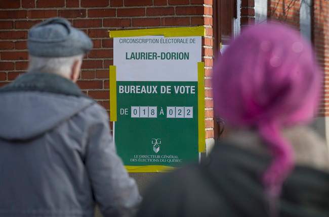 People lineup to vote at a polling station in Montreal Monday, April 7, 2014.