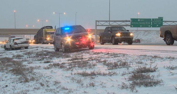 A car is left in the ditch after a collision on the Anthony Henday, Thursday, April 17, 2014.