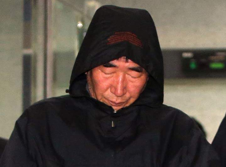 Lee Joon-seok the captain of the sunken South Korean ferry Sewol, leaves a court which issued his arrest warrant in Mokpo, south of Seoul, Saturday, April 19, 2014.