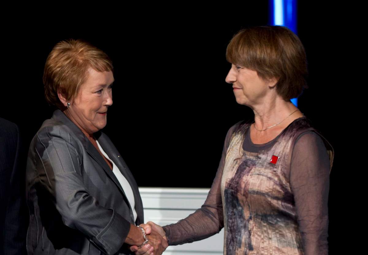 Parti Quebecois leader Pauline Marois shakes hands with Quebec Solidaire co-leader Francoise David, left to right, while on the set prior to the leaders debate Sunday, August 19, 2012 in Montreal.